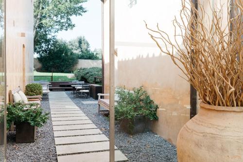 a garden with a patio with benches and plants at Riva Lofts Florence in Florence