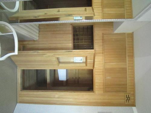 a wooden cabin with a door in a room at Hotel San Francisco Spiaggia in Rimini