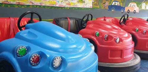 a plastic toy cars and suitcases on a table at Fun Retreat Resort, Hotel and Ayurveda Spa in Arusha