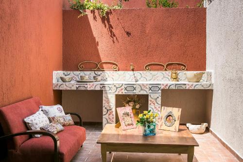 a living room with a table and a fireplace at Palazzino Di Nionio in Karavadhos
