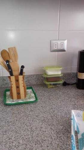 a knife and fork holder on a counter at depto nuevo temuco in Temuco