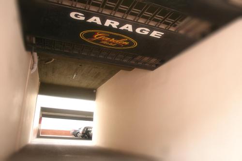 a garage sign on the ceiling of a room at Hotel Garden in San Miguel de Tucumán