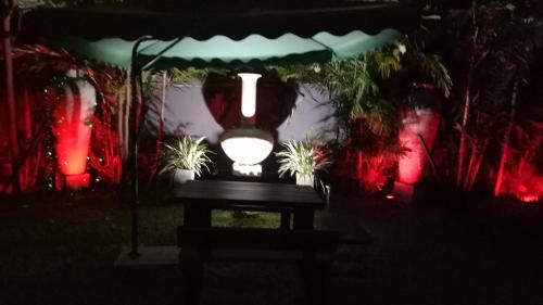 a light sitting on a table under a tent at night at Palms Villa in Negombo