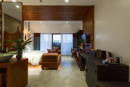 a hotel room with a bed and a bedroom at Golden Temple Boutique in Siem Reap