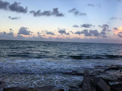 a view of the ocean at sunset at Becaville in Port Antonio