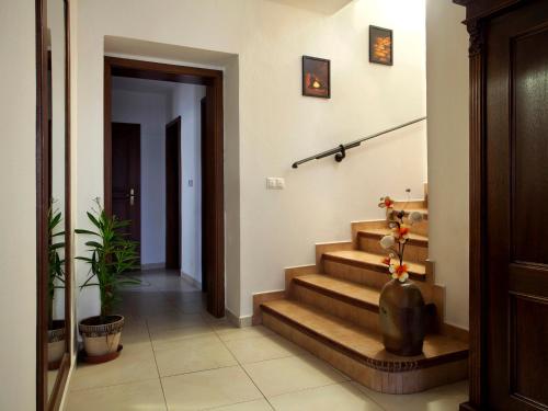 a hallway with stairs in a house at Staroměstský Penzion in Tábor