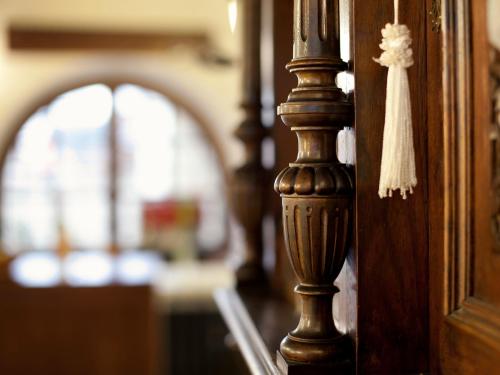 a wooden door with a tassel hanging from it at Staroměstský Penzion in Tábor