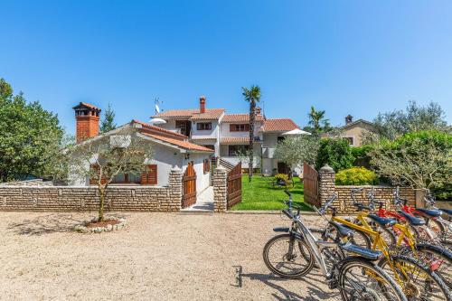 a group of bikes parked in front of a house at Apartments Rita in Poreč