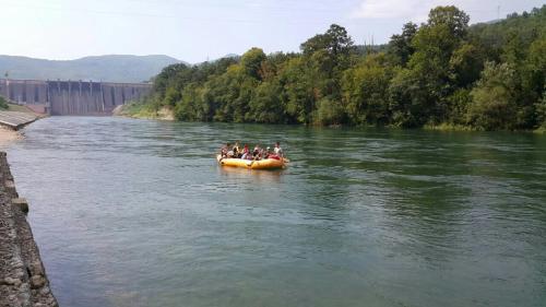 a group of people in a raft on a river at Prenoćište i restoran Ihthis in Bajina Bašta