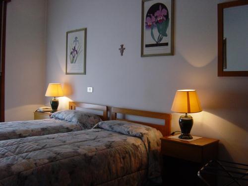 Posteľ alebo postele v izbe v ubytovaní Hotel Rizzi