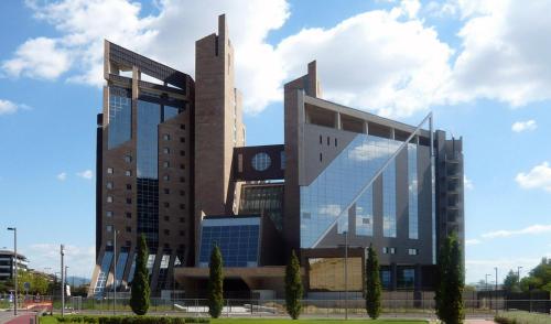 a large building with a clock on it at Hotel Indicatore in Campi Bisenzio