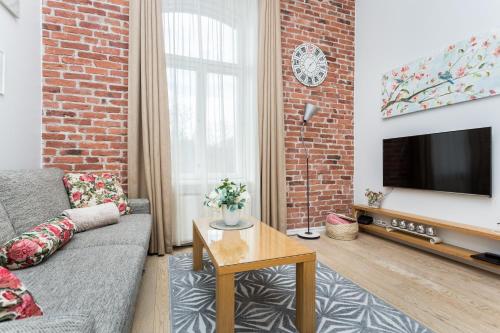 Una televisión o centro de entretenimiento en Angleterre Apartments