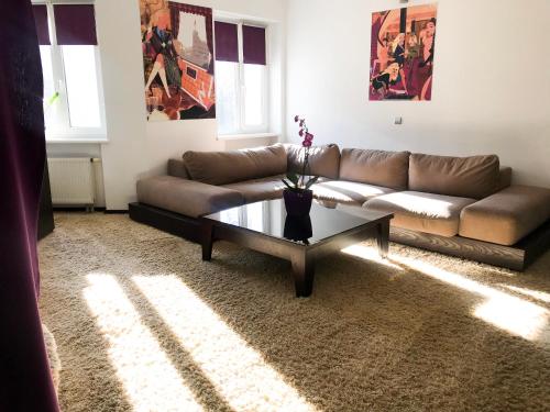 a living room with a couch and a coffee table at SPA Hotel in Vorzelʼ