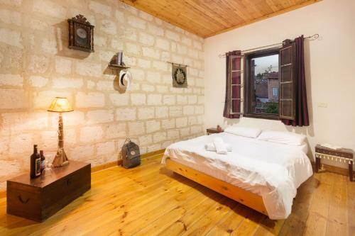 a bedroom with a bed and a window at Fauzi Azar by Abraham in Nazareth