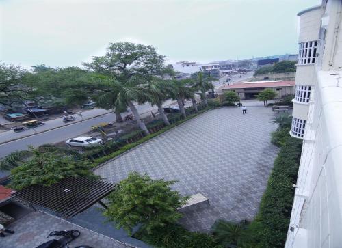 an overhead view of a street with trees and a building at Hotel Sheetal Regency,Near Janambhumi in Mathura