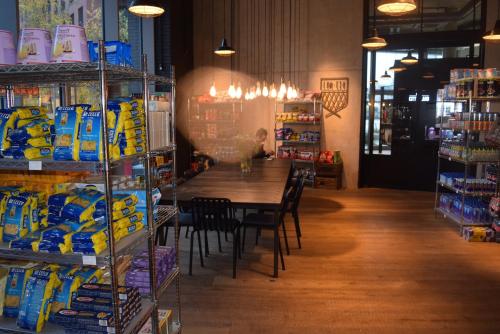 a room with a table and chairs in a store at London City Island 3 Bedroom Luxury Apartments, Canary Wharf, E14 in London