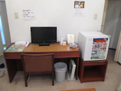 a desk with a computer and a printer on it at The Hirosawa City Dome House West Building / Vacation STAY 7781 in Chikusei
