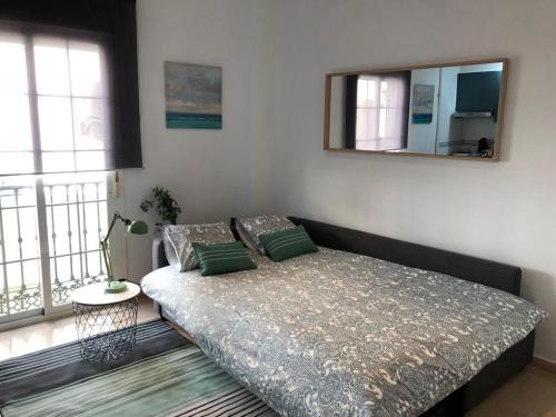 Postel nebo postele na pokoji v ubytování Charming Loft Málaga Centre