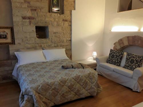 Postel nebo postele na pokoji v ubytování Suite Assisi