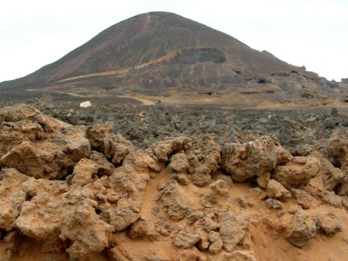a mountain in the desert with a pile of rocks at La Residencia in Mindelo