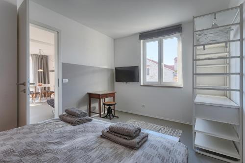 Posteľ alebo postele v izbe v ubytovaní Casa Mia Apartments