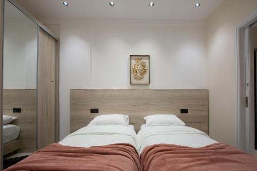 Un ou plusieurs lits dans un hébergement de l'établissement Marianthe Apartments