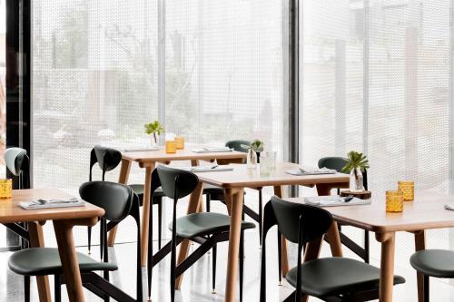
a dining room table with chairs and tables at Drift House in Port Fairy
