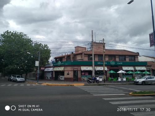 a building on the corner of a street at Departamentos Parque Benegas in Godoy Cruz