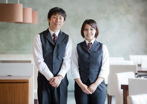 a man and woman standing next to each other at Aura Tachibana in Hakone