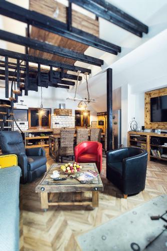 a living room with couches and a coffee table at Kopec 67 in Štramberk