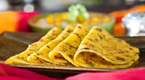 a group of tortillas on a plate on a table at Hotel International Inn - Near Delhi Airport in New Delhi