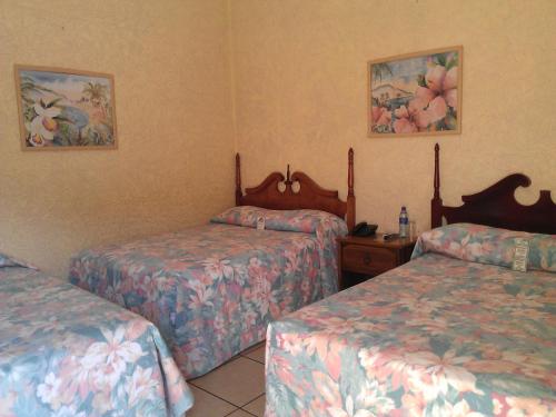 Postel nebo postele na pokoji v ubytování Hotel Cafe