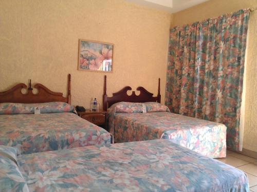 Postel nebo postele na pokoji v ubytování Hotel Cafe