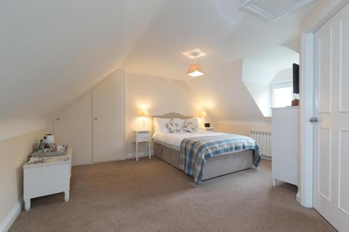 a bedroom with a bed and a tv in it at Whitethorn Bed and Breakfast in Congleton