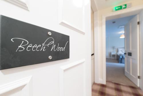 a sign on the wall of a beach room at Whitethorn Bed and Breakfast in Congleton