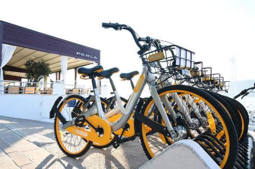 a group of bikes parked next to a building at Hotel Perla in Herceg-Novi