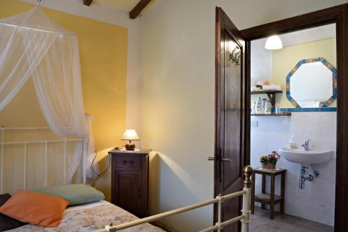 Ένα ή περισσότερα κρεβάτια σε δωμάτιο στο La Chiusuraccia