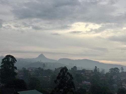 a view of a city with mountains in the background at Hotel Mount Castle in Hatton