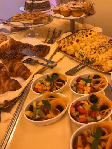 a table topped with lots of different types of food at Villa Floridiana in Anagni