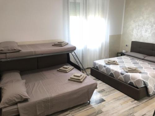 Ένα ή περισσότερα κρεβάτια σε δωμάτιο στο B&B ATTICO GALLIERA