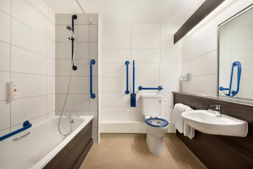 a bathroom with a sink, toilet and bathtub at Ramada Bristol West in Easton in Gordano