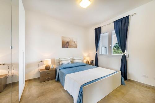 Postel nebo postele na pokoji v ubytování Caneis Apartments