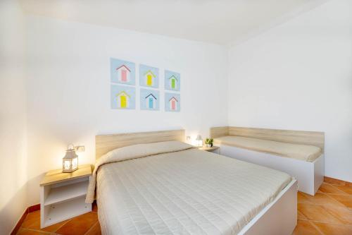Ένα ή περισσότερα κρεβάτια σε δωμάτιο στο Lu Maestrali Apartment