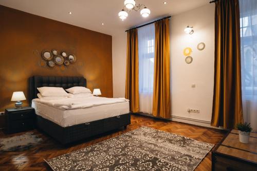 En eller flere senger på et rom på Apartament Piata Mica