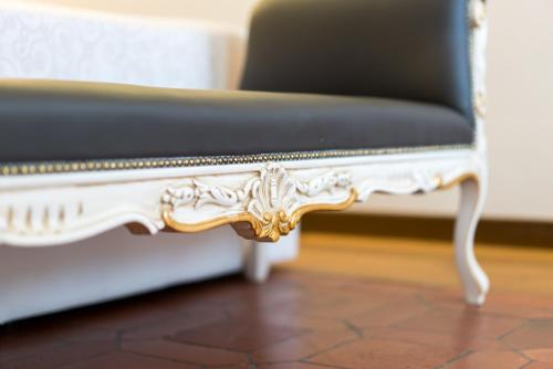 a black and white bench with a black seat at Art Hotel Villa Agape - Place of Charme in Florence