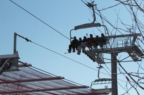a group of people on a ski lift at Hotel Schneider in Winterberg