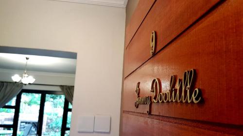 a hotel sign on the wall of a room at Barnstormers Rest in Malelane
