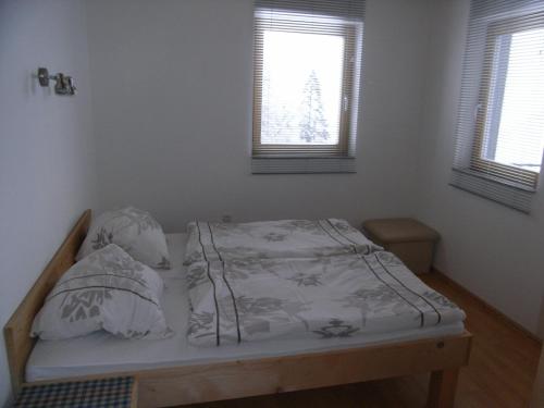 Кровать или кровати в номере Apartment-Bergblick