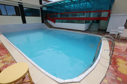 a large swimming pool in the middle of a building at Sheratton Regency Hotel in Mombasa