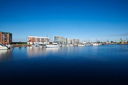 a group of boats docked in a harbor at Im-Jaich Hotel Bremerhaven in Bremerhaven